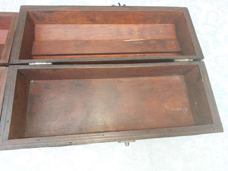 TWO ORNATE WOODEN WINE CADDYS WITH LEATHER HANDLES
