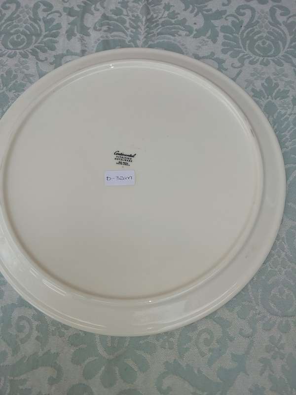 A WHITE PORCELAIN CAKE PLATE WITH A HEAVY GLASS DOME