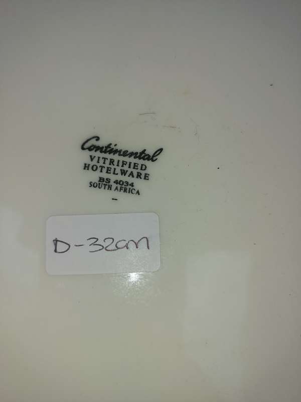 A WHITE PORCELAIN CAKE PLATE WITH A HEAVY GLASS DOME