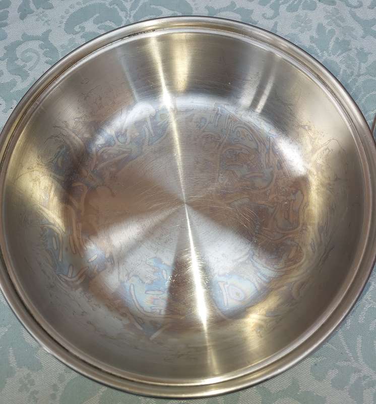A STAINLESS STEEL SERVING CASSEROLE