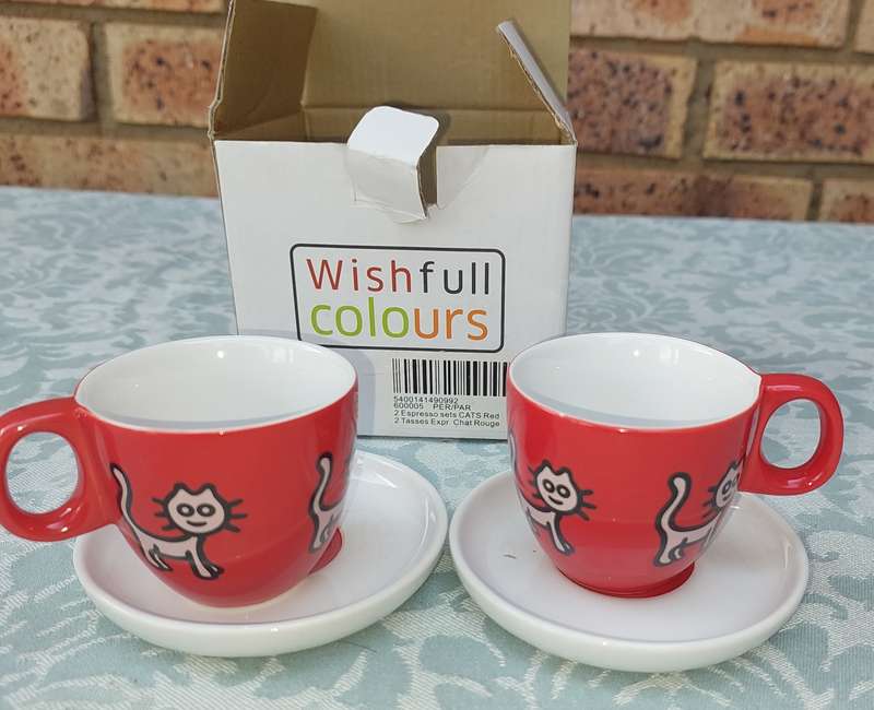 A RICHARD SCOT DESIGN SET OF COFFEE CUPS AND SAUCERS