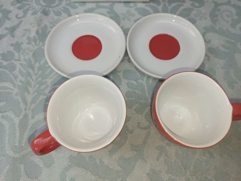 A RICHARD SCOT DESIGN SET OF COFFEE CUPS AND SAUCERS