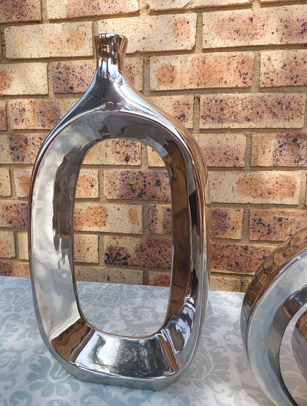A COLLECTION OF 3 ART DECOR SILVERPLATE ON CERAMIC SCULPTURES