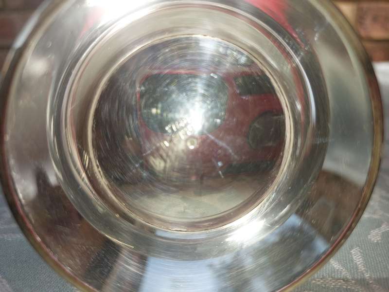 A VINTAGE SILVERPLATE ON BRONZE SUGAR SIFTER