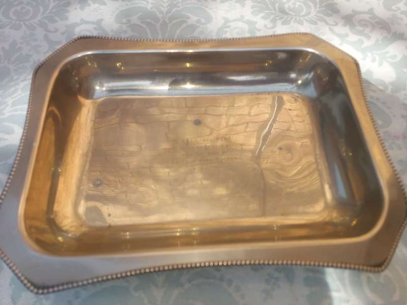 A SILVER PLATED RECTANGULAR TRAY WITH ENGRAVINGS