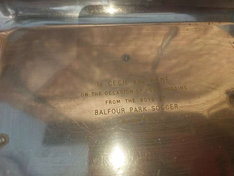 A SILVER PLATED RECTANGULAR TRAY WITH ENGRAVINGS