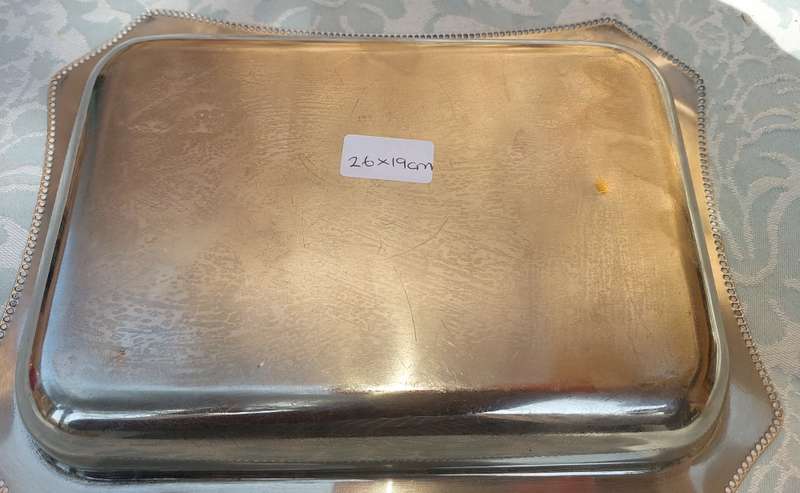 A SILVER PLATED RECTANGULAR TRAY WITH ENGRAVINGS