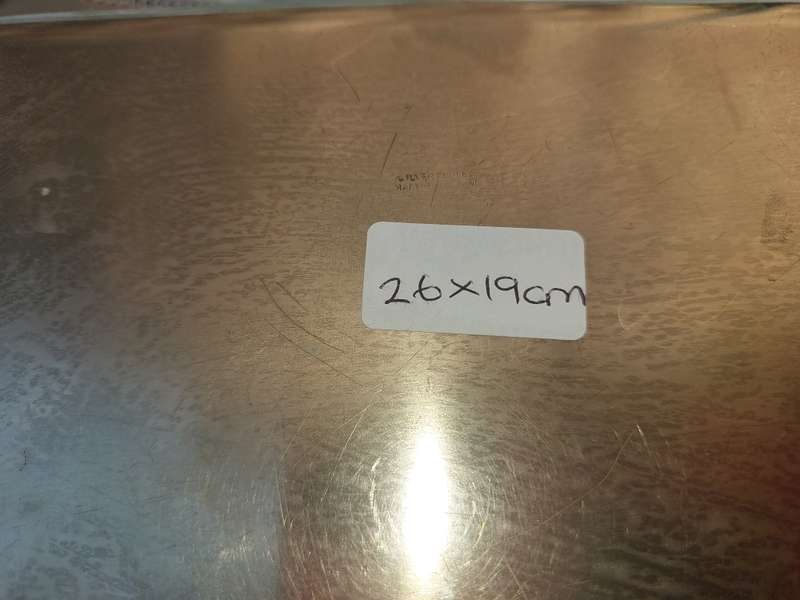 A SILVER PLATED RECTANGULAR TRAY WITH ENGRAVINGS