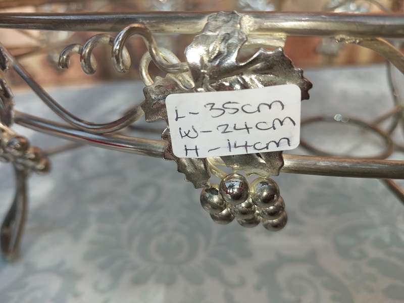 A VINTAGE GRAPEVINE CASSEROLE WARMER STAND