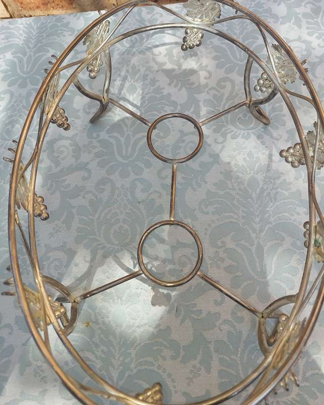 A VINTAGE GRAPEVINE CASSEROLE WARMER STAND
