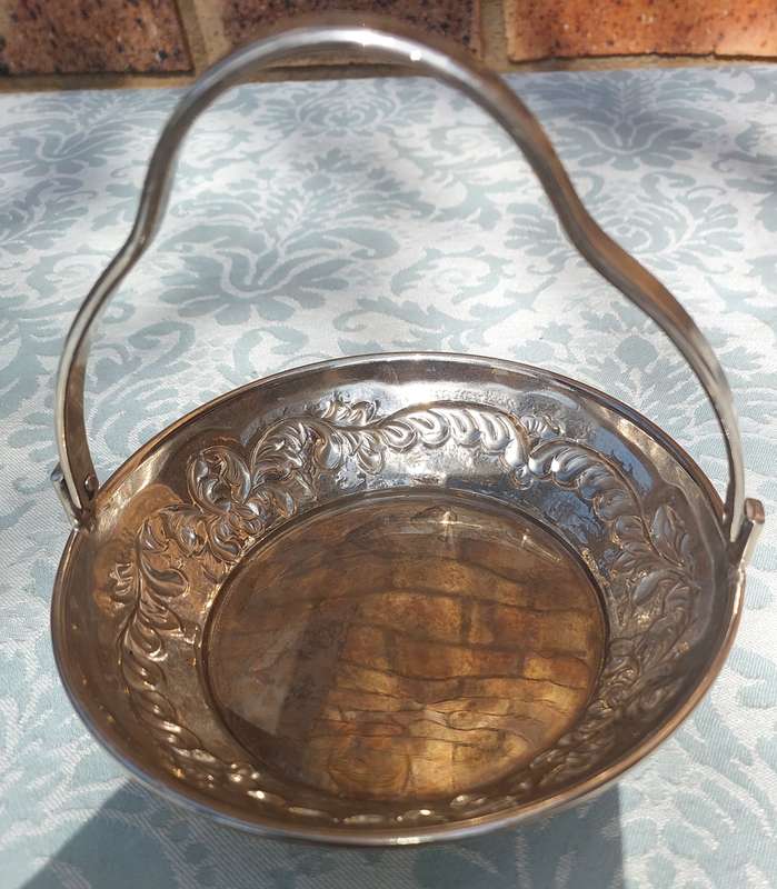 A VINTAGE SIVER PLATED CANDY BASKET SOLD AS IS