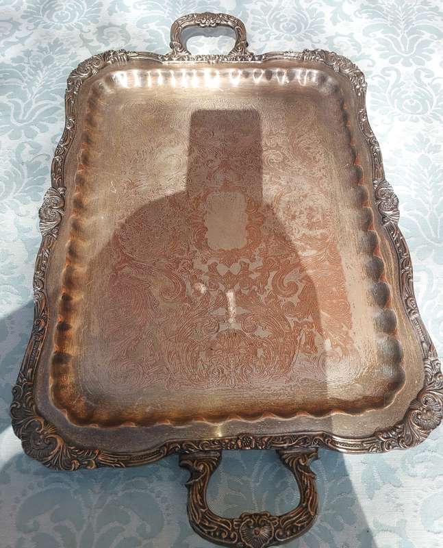 A VINTAGE FOOTED SILVER PLATED SERVING TRAY