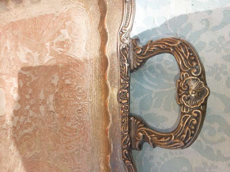 A VINTAGE FOOTED SILVER PLATED SERVING TRAY