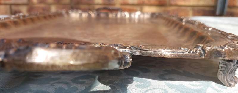 A VINTAGE FOOTED SILVER PLATED SERVING TRAY