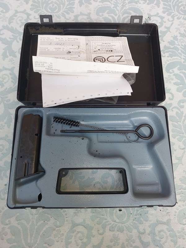 A CZ COMPACT STORAGE CASE WITH THE BRUSHES AND A MAGAZINE SOLD AS IS NO GUN