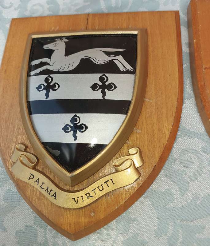 TWO COAT OF ARMS SHIELDS SOLD AS IS