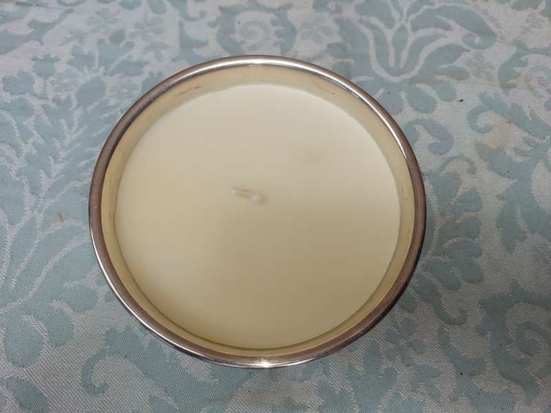 A STAINLESS STEEL BOWL CANDLE HOLDER