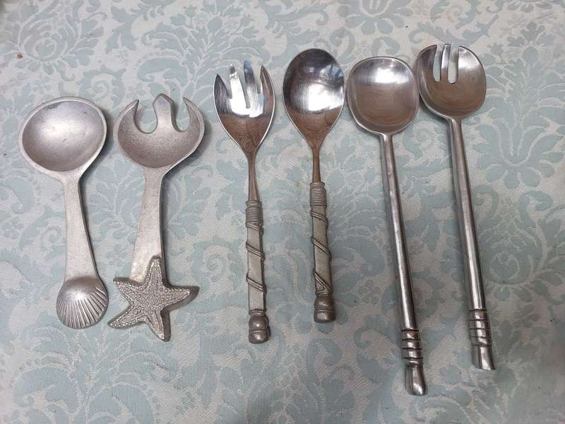 A COLLECTION OF 3 SETS OF CAROL BOYES STYLE PEWTAL SALAD LADELS SOLD AS IS
