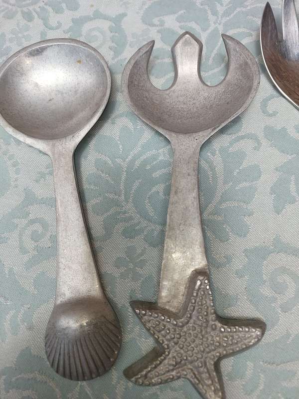 A COLLECTION OF 3 SETS OF CAROL BOYES STYLE PEWTAL SALAD LADELS SOLD AS IS