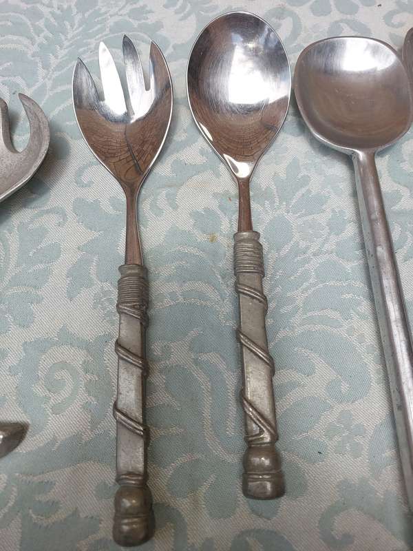 A COLLECTION OF 3 SETS OF CAROL BOYES STYLE PEWTAL SALAD LADELS SOLD AS IS