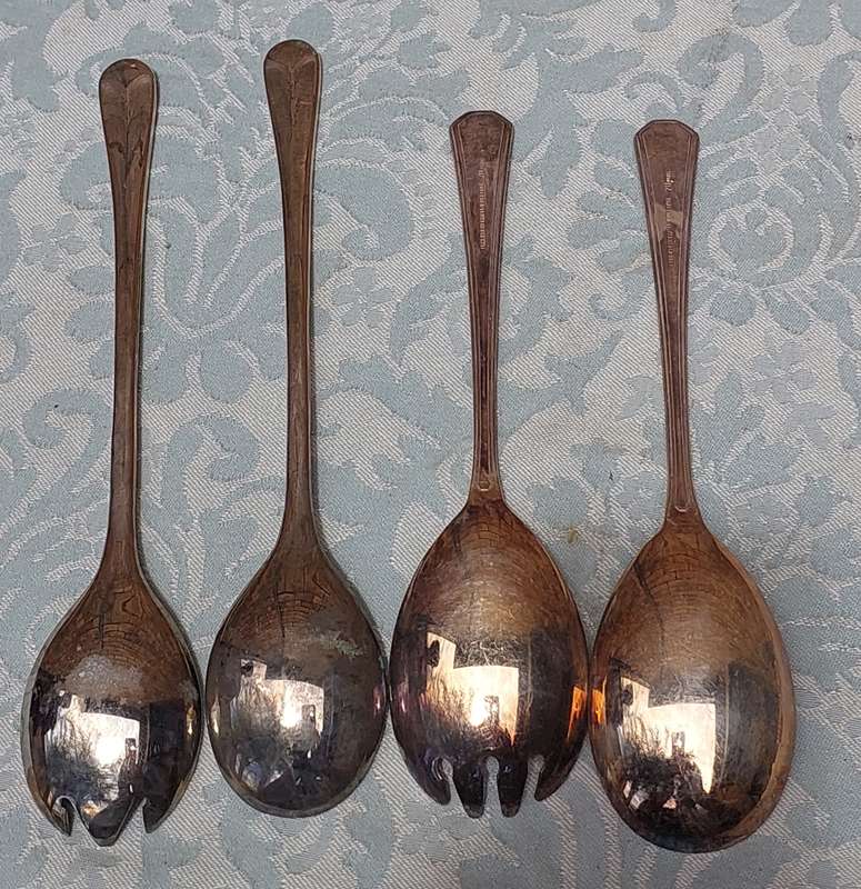TWO SETS OF SILVER PLATED SALAD LADELS SOLD AS IS