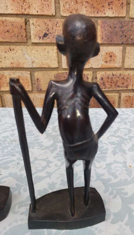 A PAIR OF VINTAGE HARD WOOD AFRICAN ART SCULPTURES SOLD AS IS