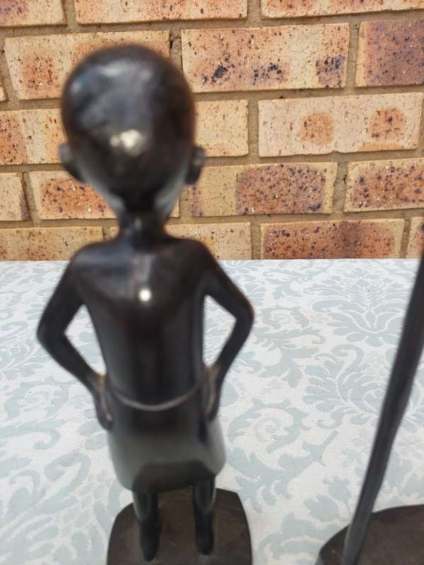 A PAIR OF VINTAGE HARD WOOD AFRICAN ART SCULPTURES SOLD AS IS