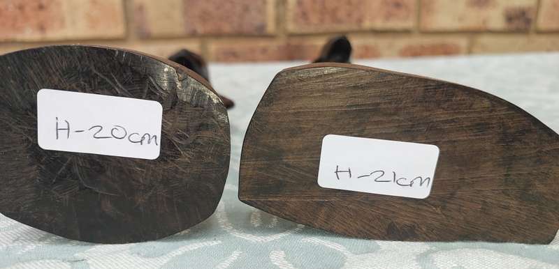A PAIR OF VINTAGE HARD WOOD AFRICAN ART SCULPTURES SOLD AS IS
