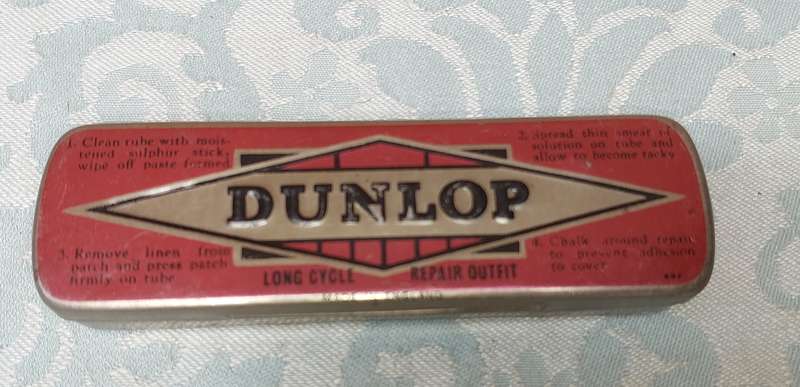 A VINTAGE BICYCLE PUNCTURE REPAIR KIT BY DUNLOP SOLD AS IS