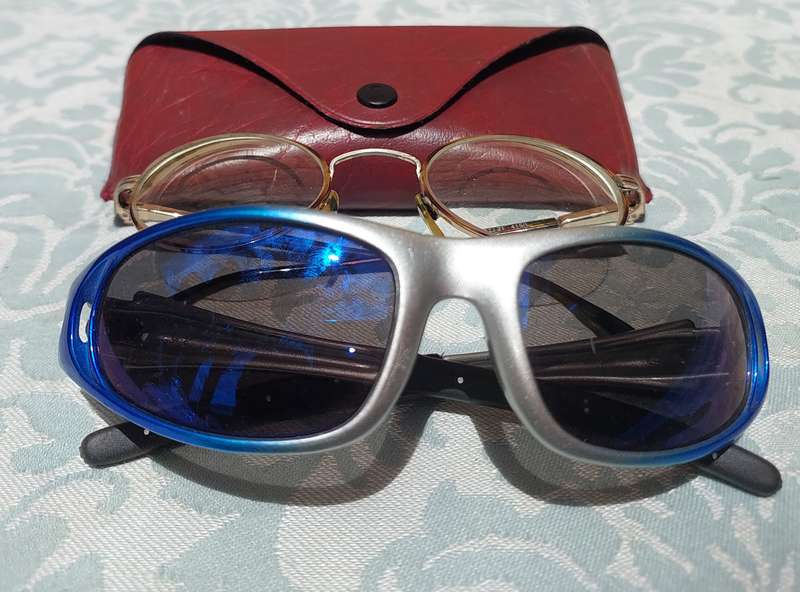 A COLLECTION OF SUNGLASSES AND AN ANTIQUE SPECTACLE SOLD AS IS