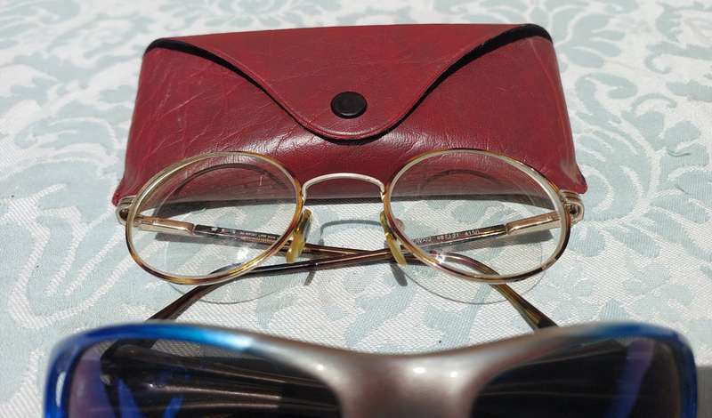 A COLLECTION OF SUNGLASSES AND AN ANTIQUE SPECTACLE SOLD AS IS
