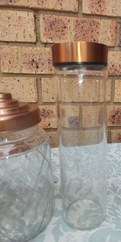 A COLLECTION OF GLASS STORAGE JARS SOLD AS IS