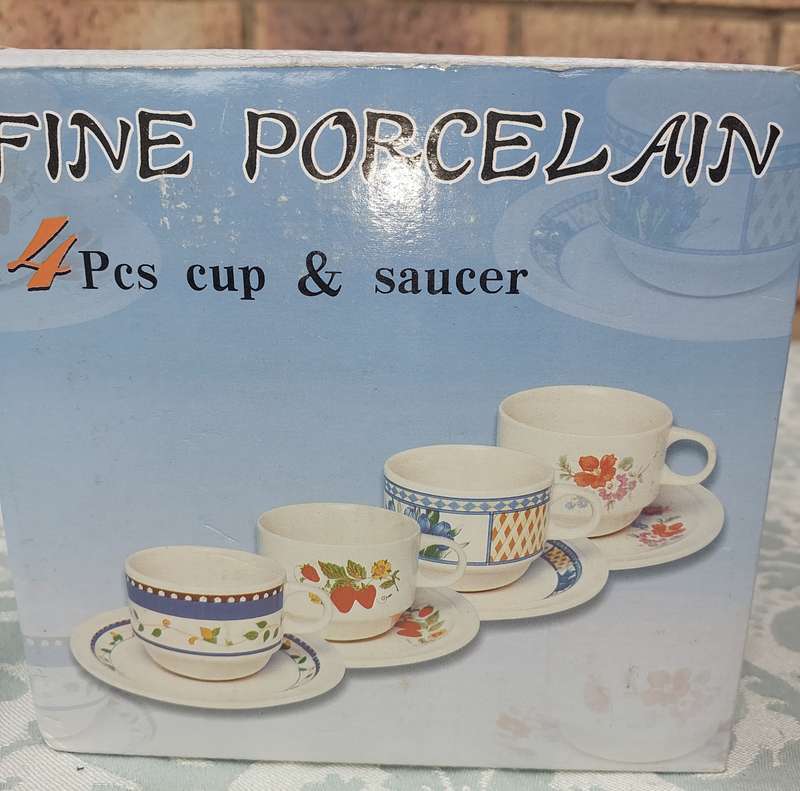A 4 PIECE FINE PORCELAIN CUP AND SAUCER SET