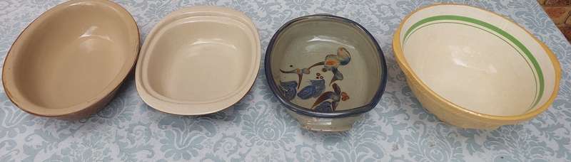 A COLLECTION OF OVEN PROOFE CERAMIC CASSEROLES