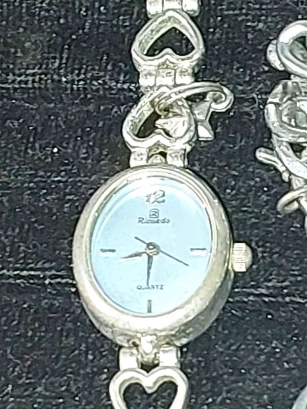 A JOBLOT BRACELET WATCHES AND CHARMS SILVER PLATE SOLD AS IS
