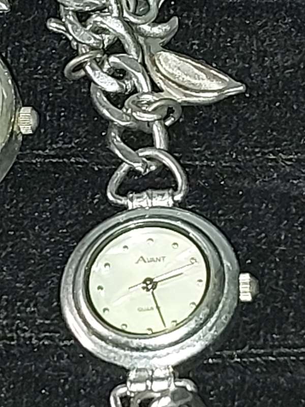 A JOBLOT BRACELET WATCHES AND CHARMS SILVER PLATE SOLD AS IS