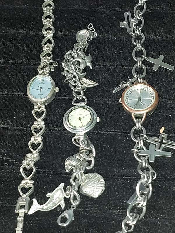 A JOBLOT BRACELET WATCHES AND CHARMS SILVER PLATE SOLD AS IS
