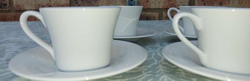 A VINTAGE SET OF 12 TEACUPS AND SAUCERS