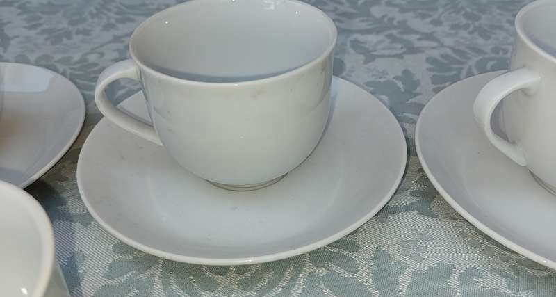 A vintage collection of 6 cups and 4 saucers white porcelain Royal Avon