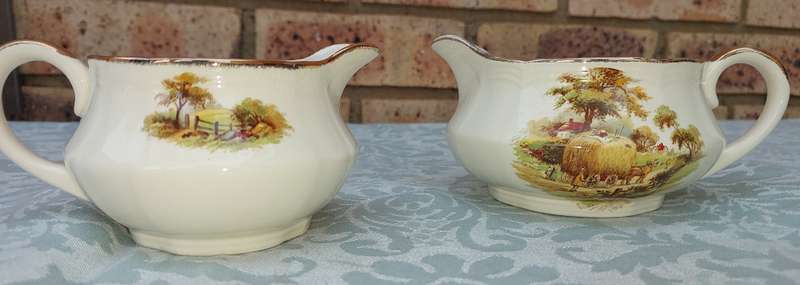 TWO VINTAGE ALFRED MEAKEN ENGLAND JUGS WITH GOLD TRIM SOLD AS IS
