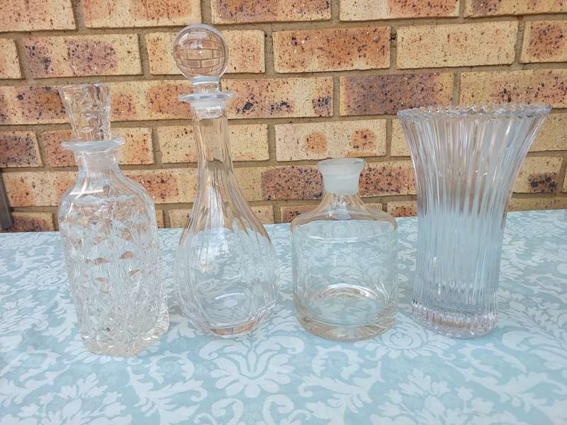 A vintage joblot decanters and vase sold as is