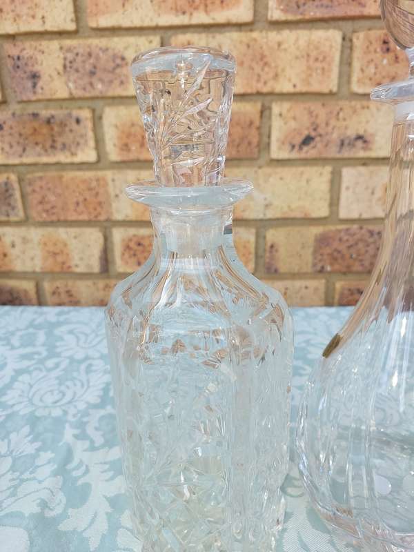 A vintage joblot decanters and vase sold as is