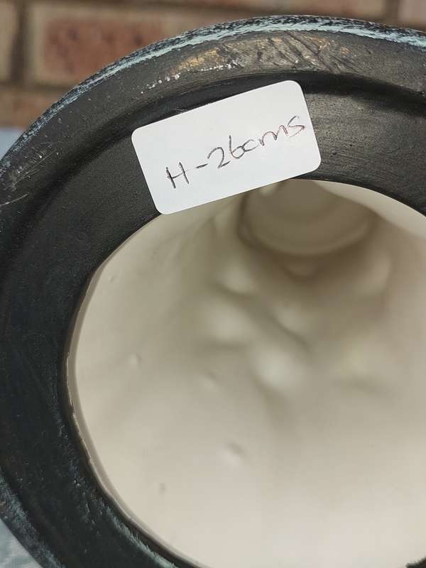 AN ART DECR CERAMIC GREEN VASE SOLD AS IS