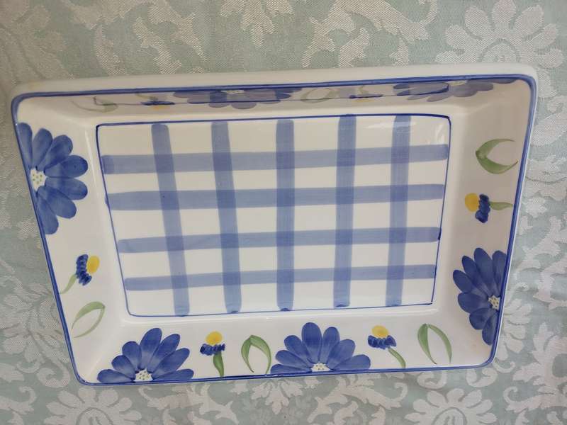 A hand-painted floral blue and white porcelain oven-proof DISHES