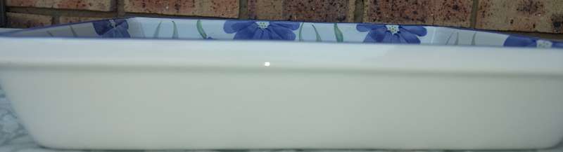 A hand-painted floral blue and white porcelain oven-proof DISHES