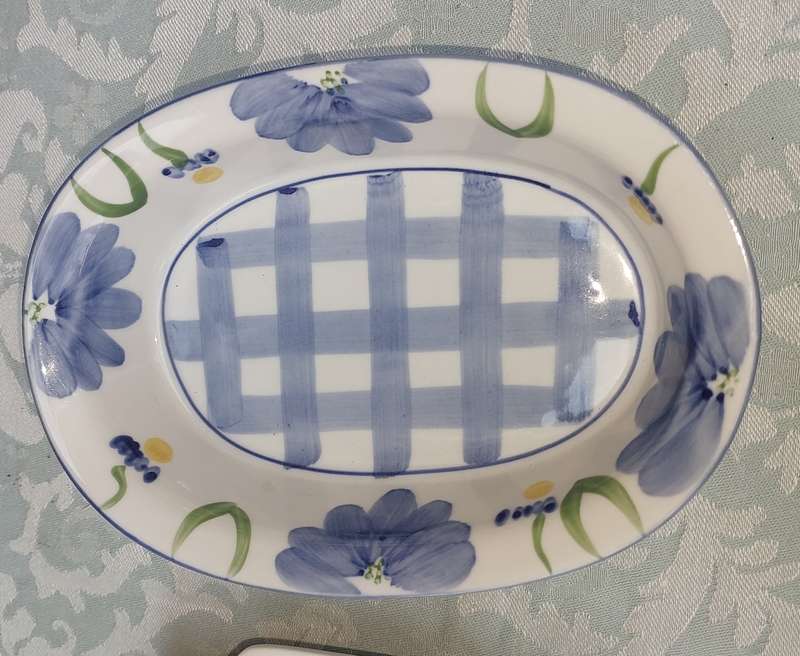 A hand-painted floral blue and white porcelain oven-proof DISHES