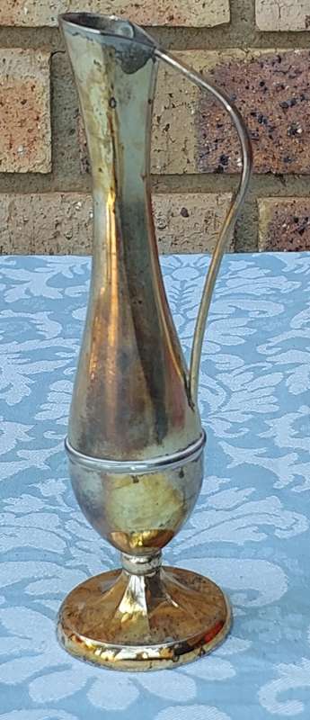 A SILVER PLATED FLOWER VASE SOLD AS IS
