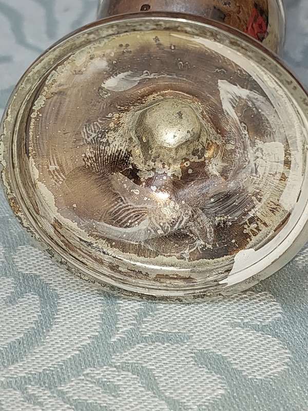 A SILVER PLATED FLOWER VASE SOLD AS IS