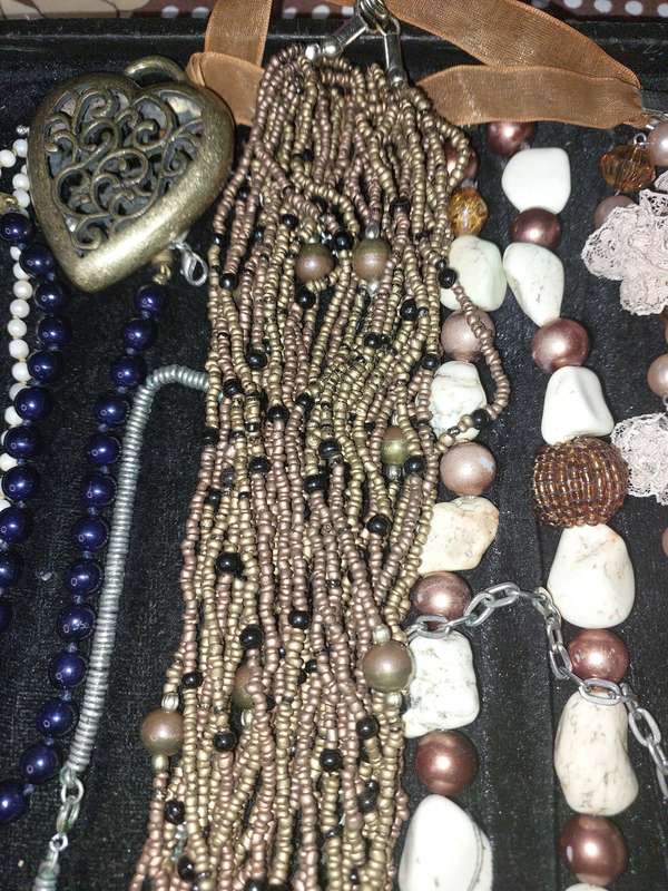 A COLLECTION OF COSTUME NECKLACES SOLD AS IS