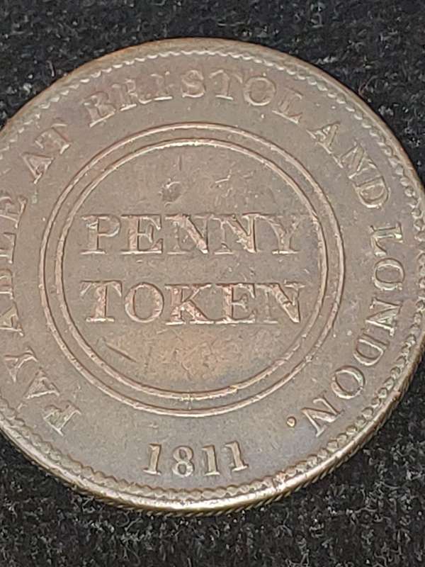 AN ANTIQUE JOBLOT COLLECTION PENNY'S AND RAILWAY TOKENS FROM BRITTAIN AND SOUTH AFRICA SOLD AS IS